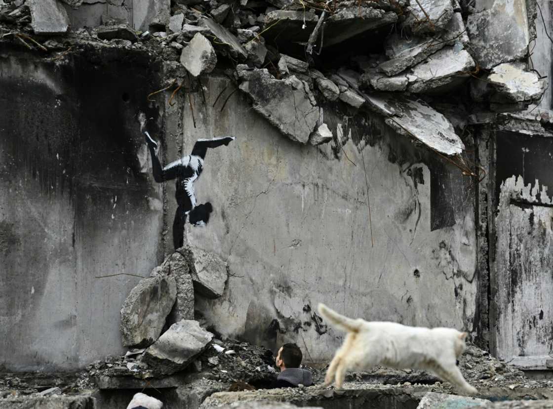 The image of a gymnast performing a handstand amid the ruins of a demolished building in the town of Borodyanka northwest of the Ukrainian capital Kyiv