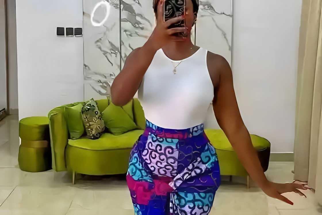 A woman is rocking a white cami top A woman is rocking a white cami top