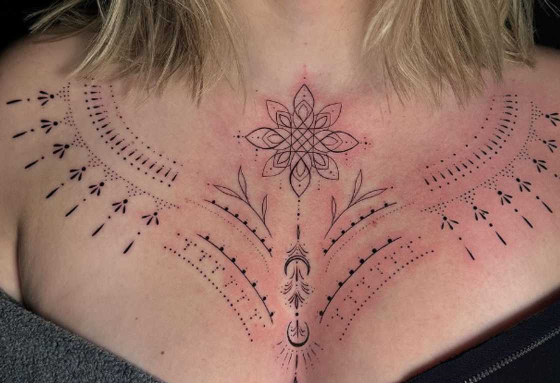 Delicate dot work collarbone and chest tattoo