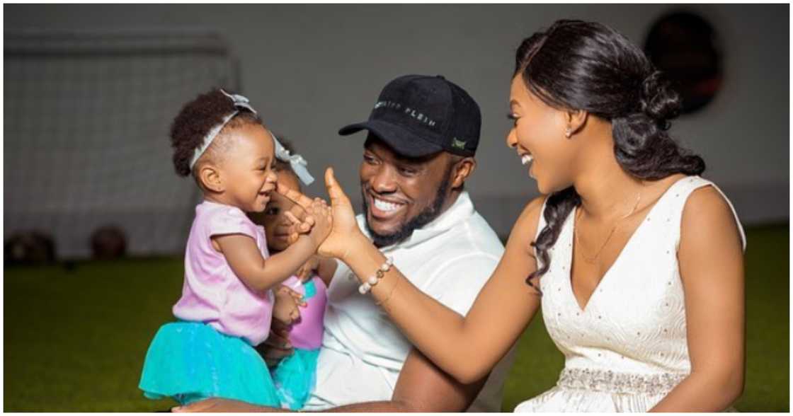 Kennedy Osei smiling in photos with his family Kennedy Osei smiling in photos with his family
