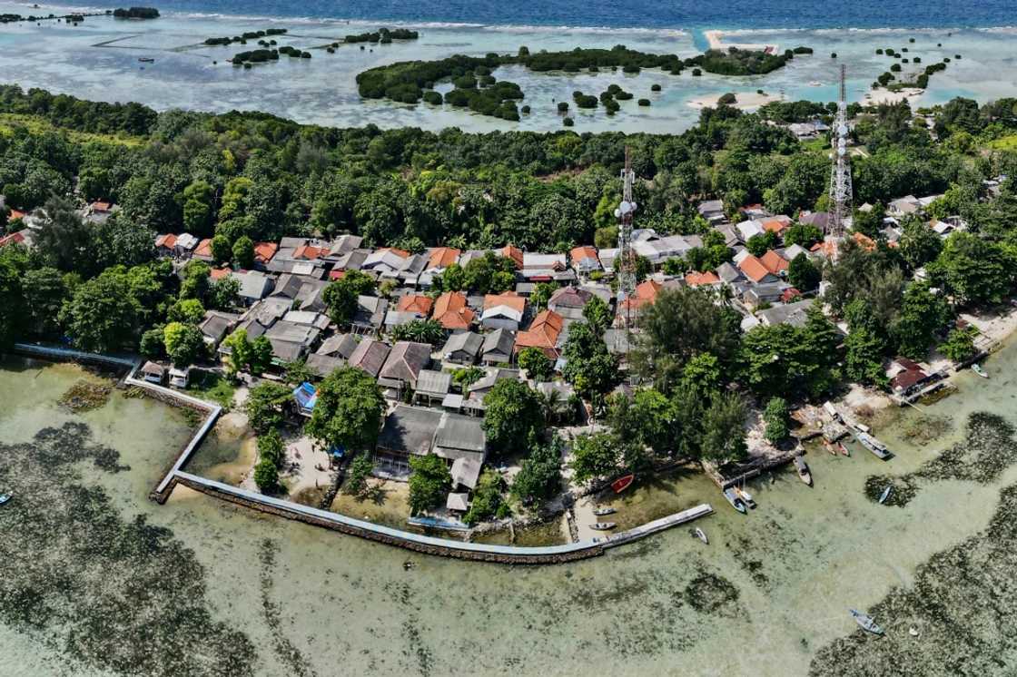 A concrete embankment around parts of Pari island is used to stem rising sea levels