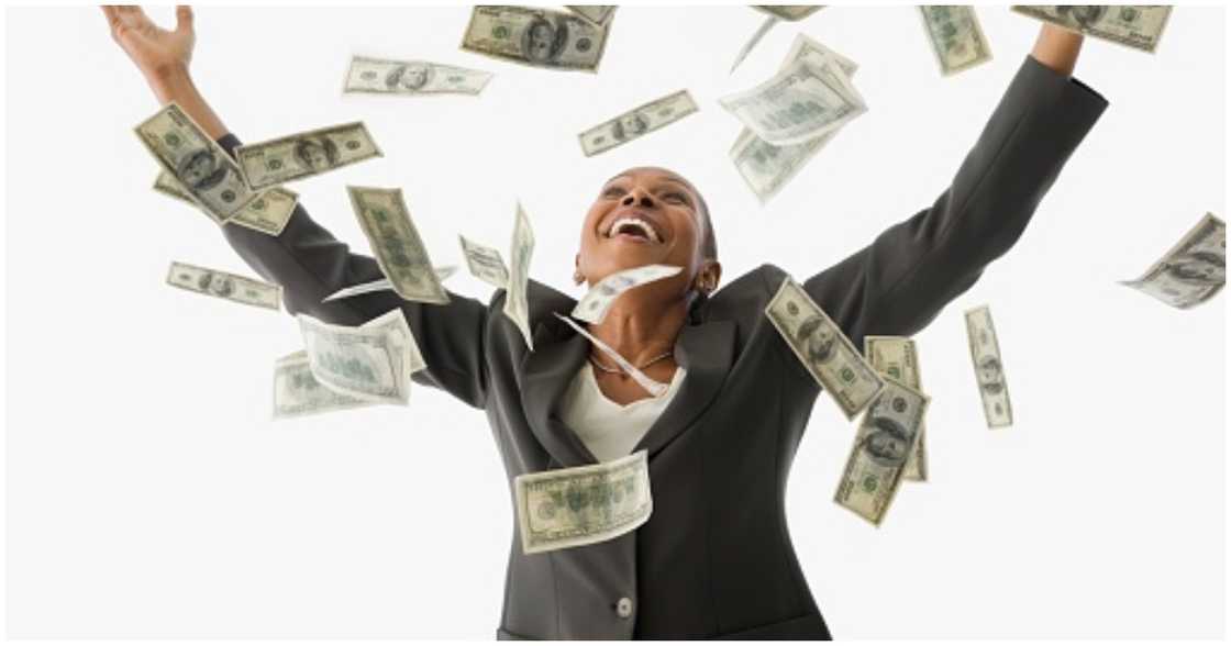 A woman shows excitement about getting money