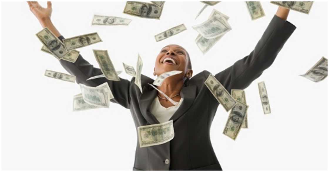 A woman shows excitement about getting money A woman shows excitement about getting money