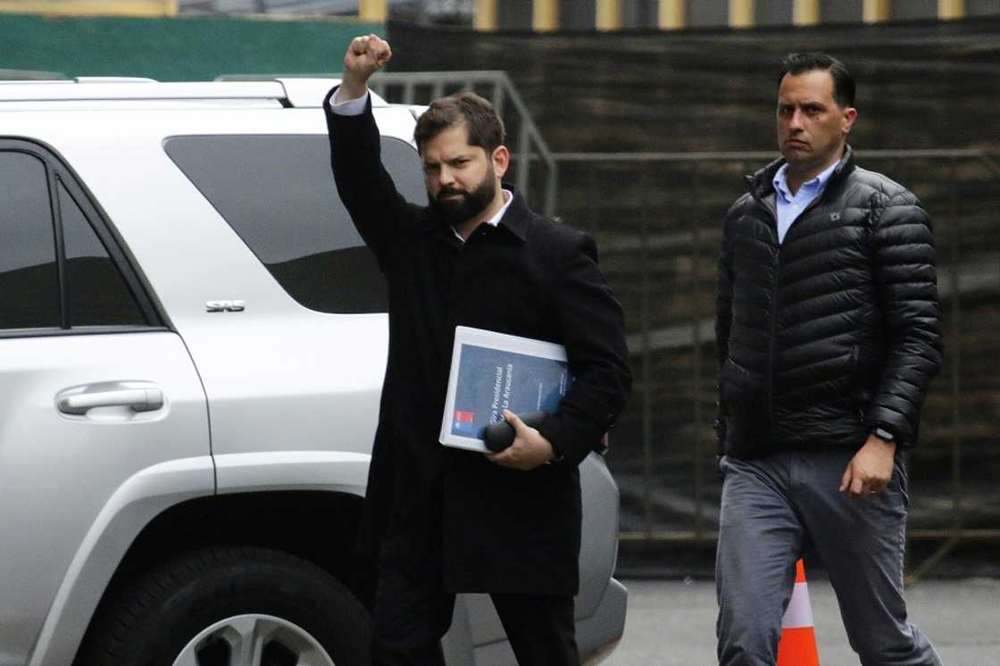 Chile President Gabriel Boric waves upon his arrival in the restive Araucania region on November 10, 2022