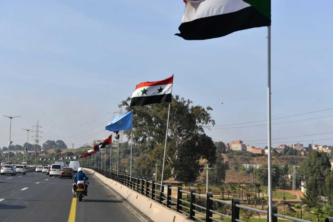 National flags of Arab countries line a highway in the Algerian capital Algiers National flags of Arab countries line a highway in the Algerian capital Algiers