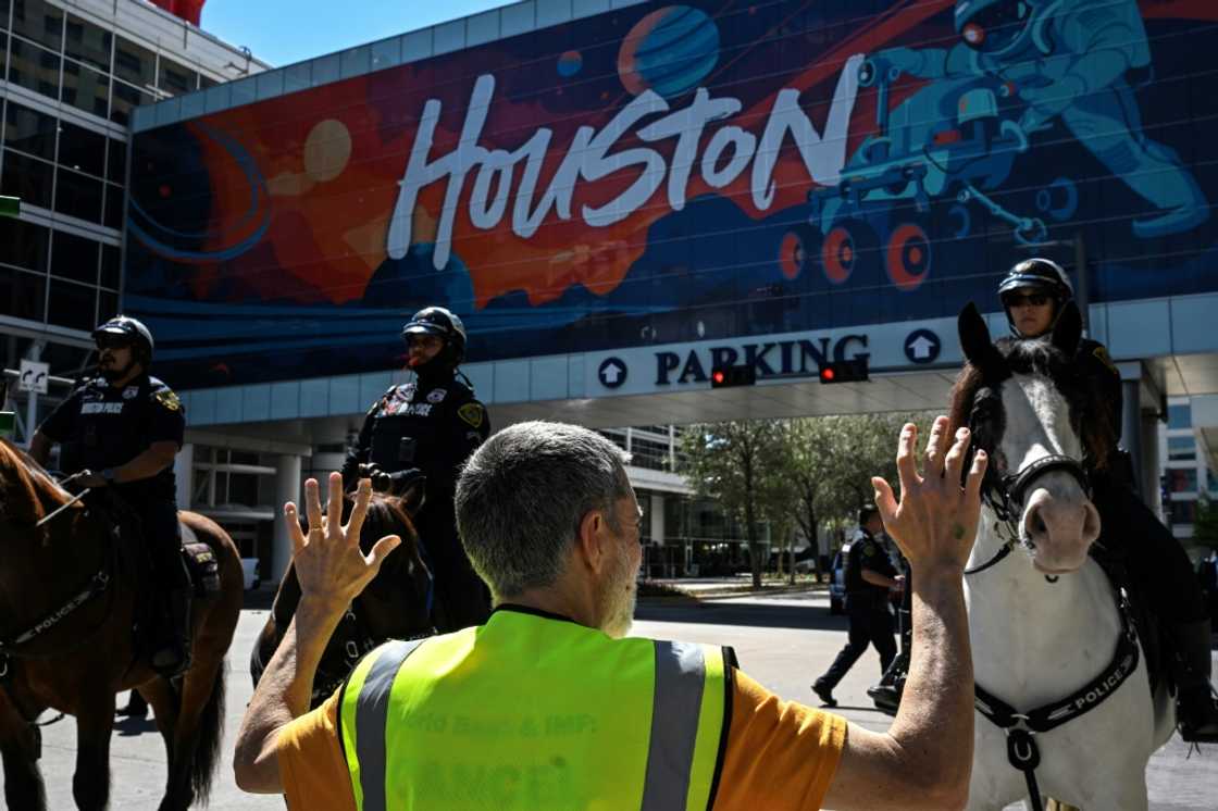 Demonstrators protest against the Ceraweek by S&P Global energy conference, near the hotel where the conference is being attended, in Houston, Texas, on March 10, 2025 Demonstrators protest against the Ceraweek by S&P Global energy conference, near the hotel where the conference is being attended, in Houston, Texas, on March 10, 2025