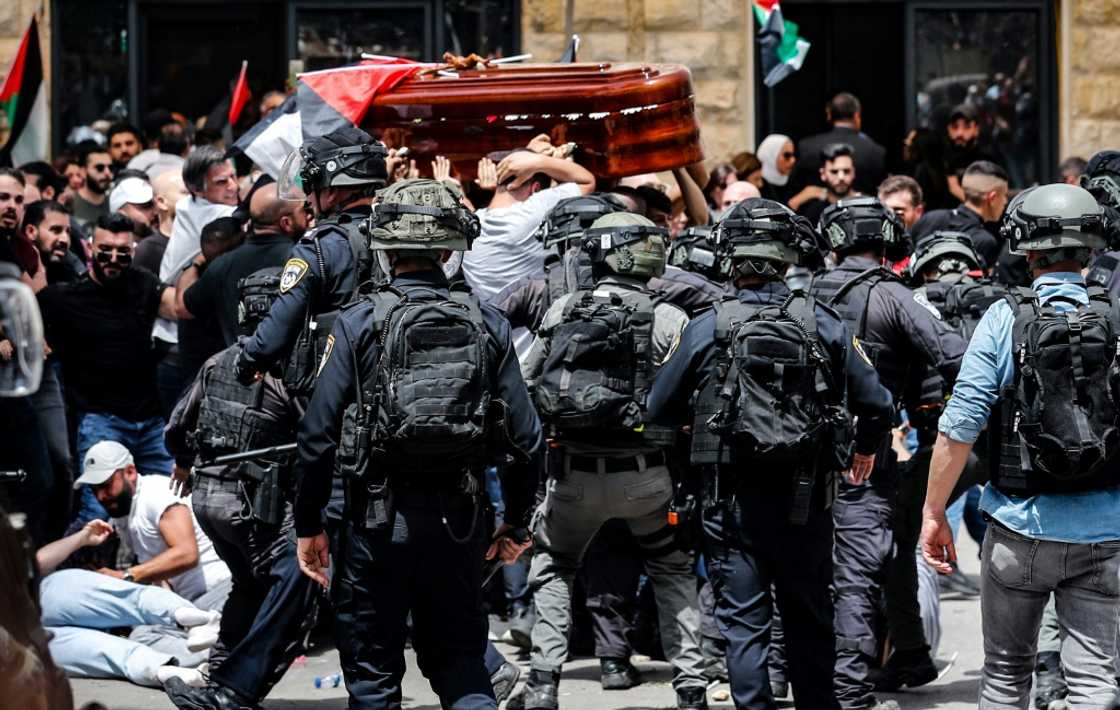 Violence erupts between Israeli security forces and Palestinian mourners carrying the casket of slain Al-Jazeera journalist Shireen Abu Akleh on May 13, 2022 in Jerusalem Violence erupts between Israeli security forces and Palestinian mourners carrying the casket of slain Al-Jazeera journalist Shireen Abu Akleh on May 13, 2022 in Jerusalem
