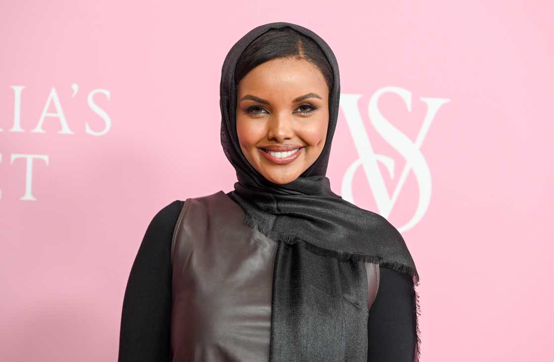 Halima Aden, in a black and brown outfit, smiles for a photo in New York, New York Halima Aden, in a black and brown outfit, smiles for a photo in New York, New York