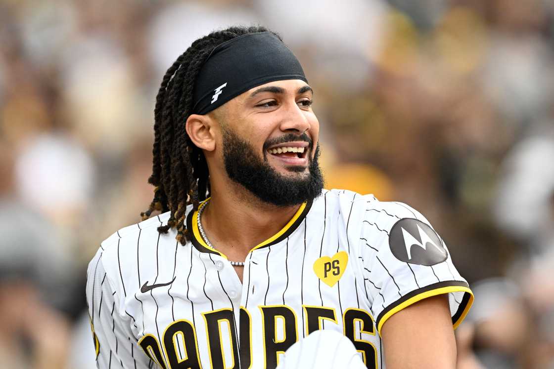 Fernando Tatis looks on from the dugout during a baseball game against the Houston Astros