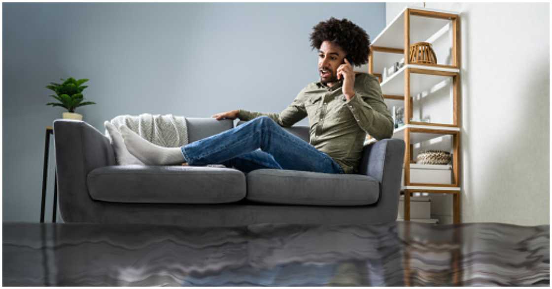 A man calls for help after his home gets flooded A man calls for help after his home gets flooded