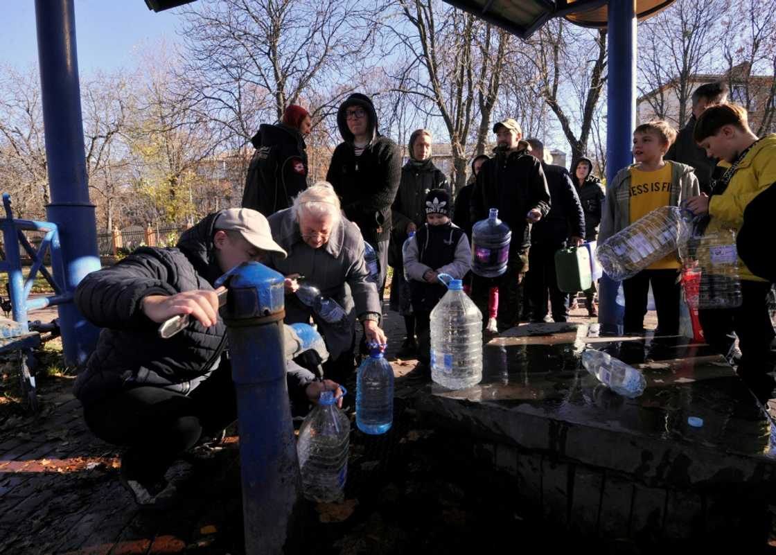 Kyiv residents filled up on water at a park in the Ukrainian capital on Monday Kyiv residents filled up on water at a park in the Ukrainian capital on Monday