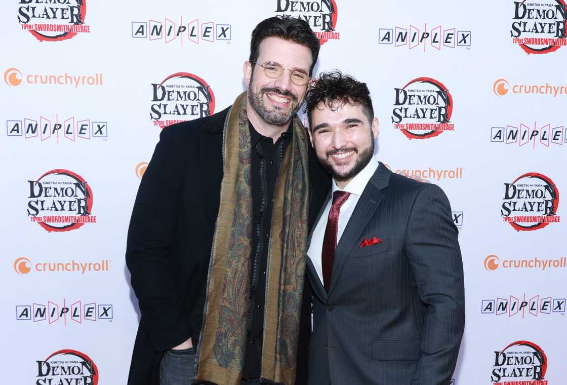 J. Michael Tatum (L) and Brandon McInnis (R) pose at the "Demon Slayer: Kimetsu No Yaiba - To the Swordsmith Village" Crunchyroll premiere.