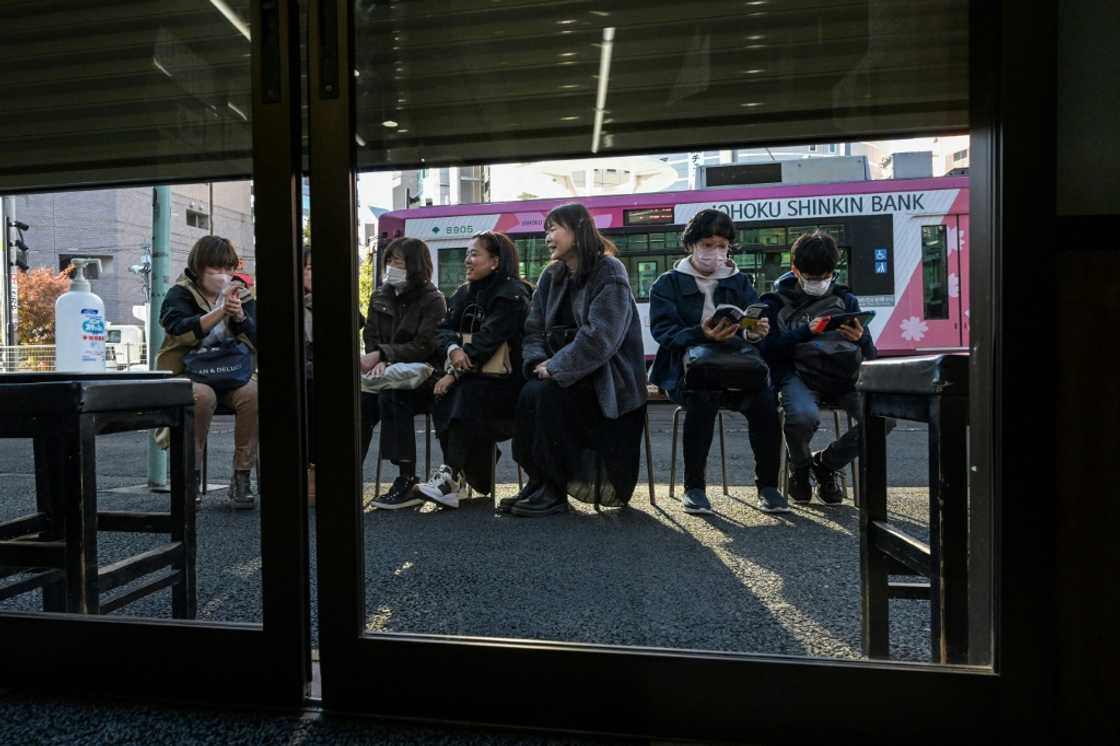 Customers queue outside Tokyo's Onigiri Bongo 90 minutes before the shop opens Customers queue outside Tokyo's Onigiri Bongo 90 minutes before the shop opens