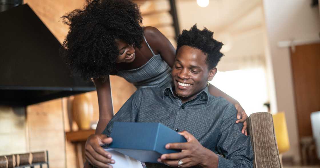 Young man receives Apple watch as gift Young man receives Apple watch as gift
