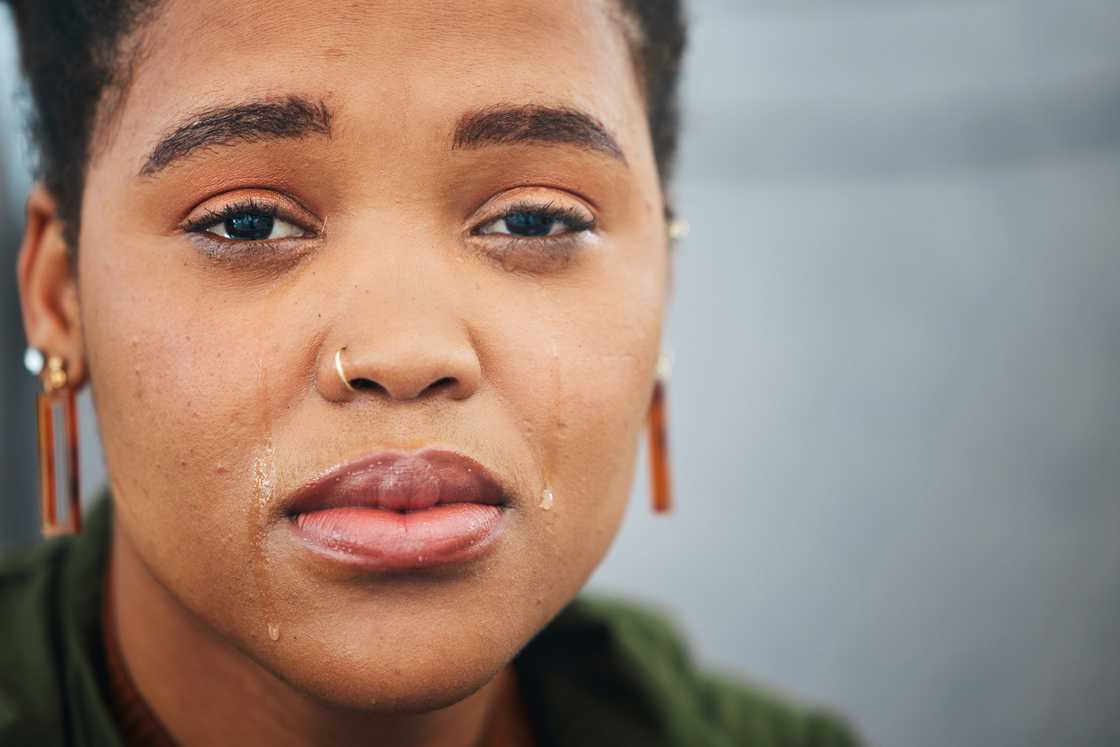 A woman talking with tears