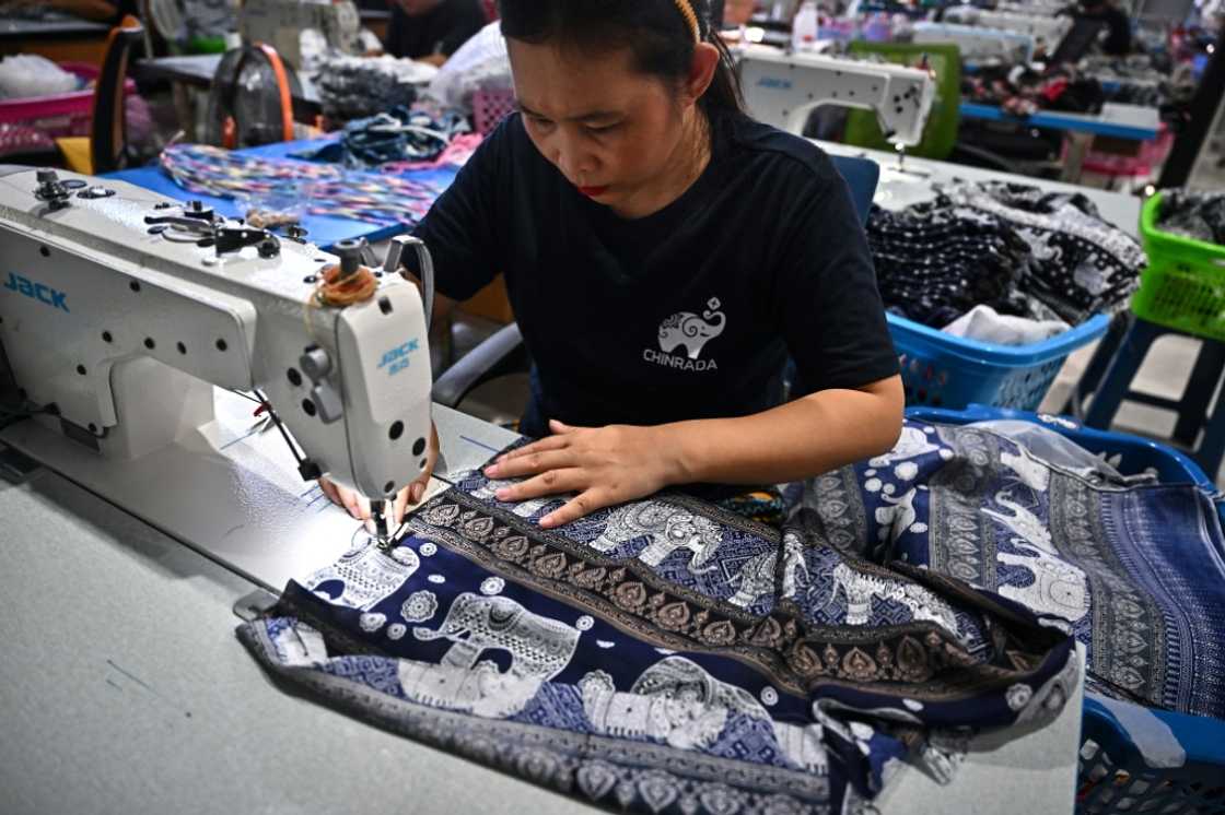A worker assembles elephant print clothing at the Chinrada Garment factory in northern Thailand's Chiang Mai A worker assembles elephant print clothing at the Chinrada Garment factory in northern Thailand's Chiang Mai