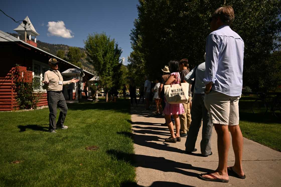 A poll worker speaks to people as they wait in line to vote in the Republican primary election at the Old Wilson Schoolhouse Community Center in Wilson, Wyoming, on August 16, 2022 A poll worker speaks to people as they wait in line to vote in the Republican primary election at the Old Wilson Schoolhouse Community Center in Wilson, Wyoming, on August 16, 2022