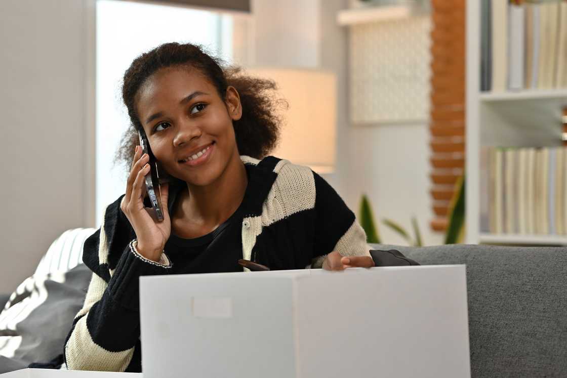 A happy woman making a call A happy woman making a call