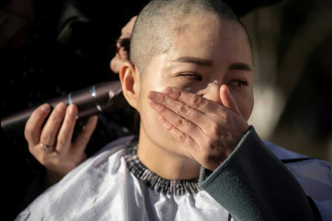 Li Wenzu had her head shaved in 2018 to protest the detention of her husband and human rights lawyer Wang Quanzhang Li Wenzu had her head shaved in 2018 to protest the detention of her husband and human rights lawyer Wang Quanzhang