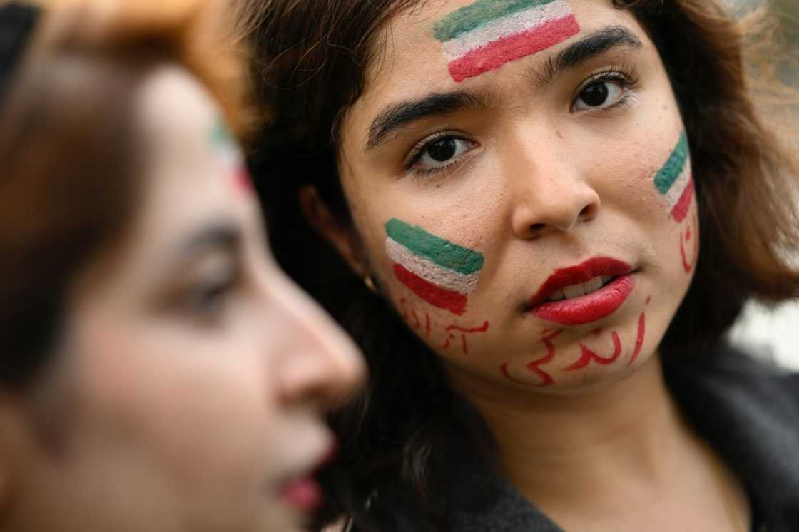 A protester in Nantes in France has her face painted with an Iranian flag in support of Kurdish woman Mahsa Amini on Monday A protester in Nantes in France has her face painted with an Iranian flag in support of Kurdish woman Mahsa Amini on Monday