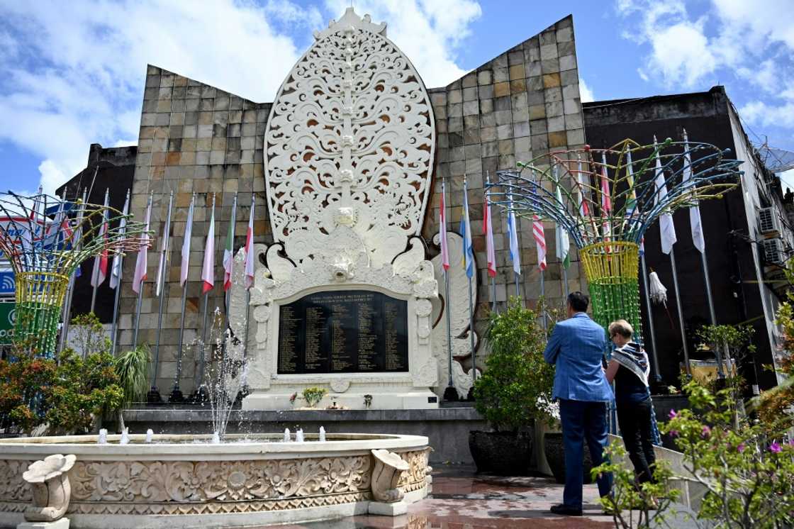 Foreign tourists visit the memorial for victims of the 2002 Bali bombings ahead of the 20th anniversary