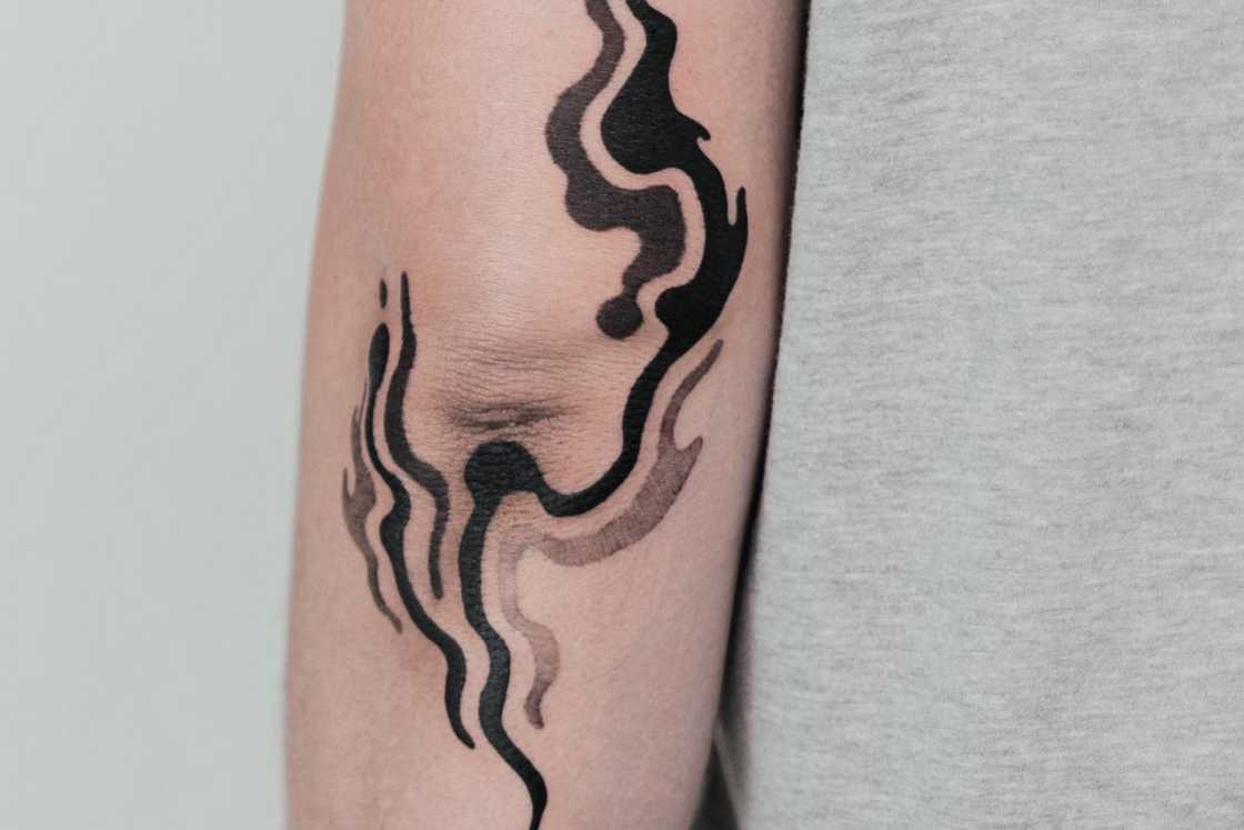 Black and grey lbow flash tattoo Black and grey lbow flash tattoo
