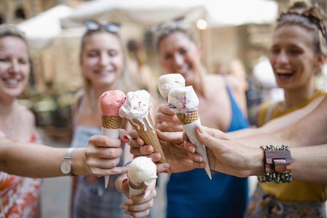 A small group of women enjoy ice cream in Volterra, Italy. A small group of women enjoy ice cream in Volterra, Italy.