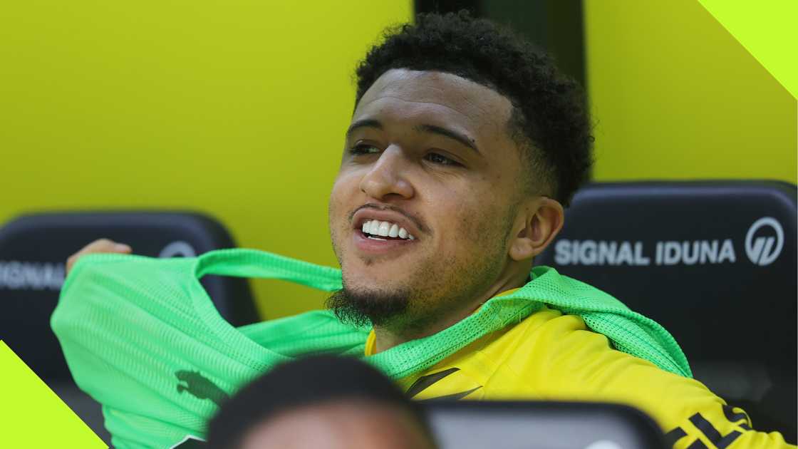 Jadon Sancho smiles on the bench during his time at Borussia Dortmund. Jadon Sancho smiles on the bench during his time at Borussia Dortmund.
