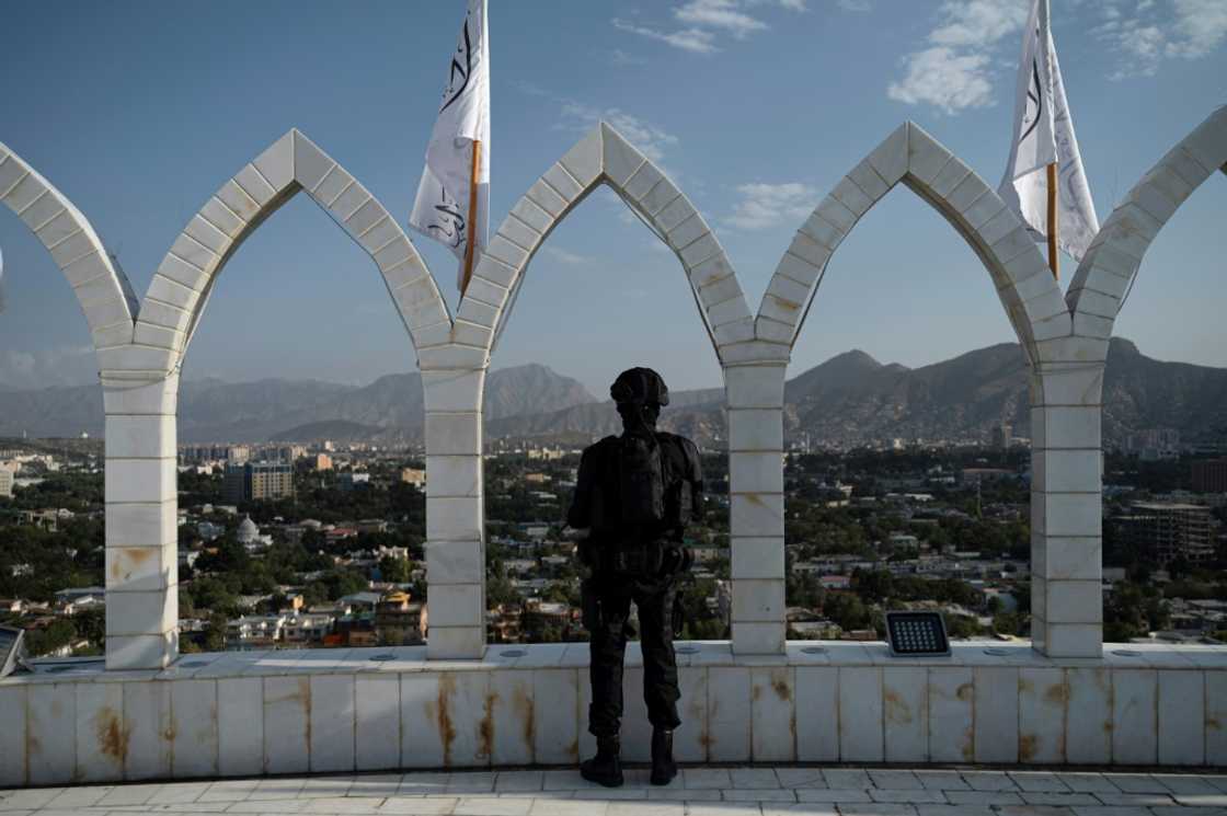 A Taliban fighter stands guard in Kabul on the eve of the first anniversary of the end of the war with US-led foreign forces A Taliban fighter stands guard in Kabul on the eve of the first anniversary of the end of the war with US-led foreign forces