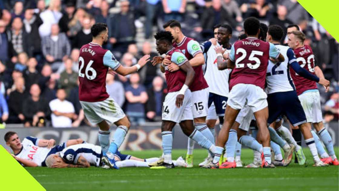 Players of West Ham pull Mohammed Kudus away after he had an altercation with Micky van de Ven and Pape Sarr.