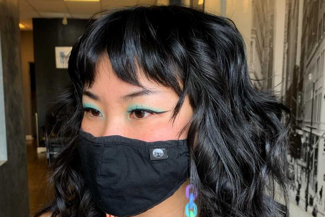 A lady is rocking a layered hairstyle A lady is rocking a layered hairstyle