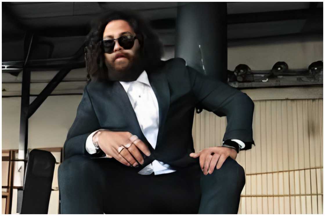 Corey Robinson in a black suit. Corey Robinson in a black suit.