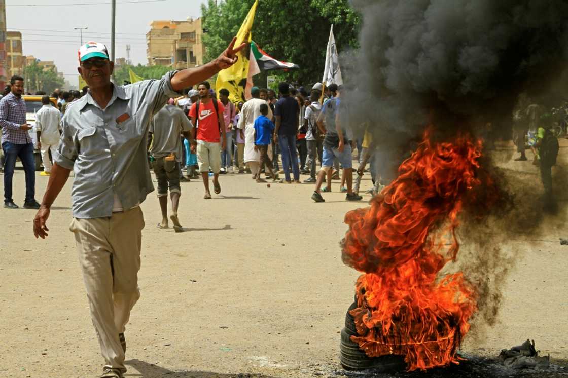 Sudanese protesters rally at the Bashadar station, south of the capital Khartoum Sudanese protesters rally at the Bashadar station, south of the capital Khartoum