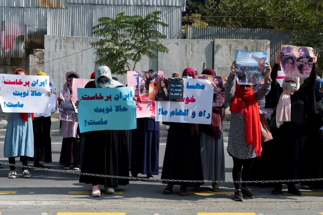 Taliban forces fired shots into the air to disperse a women's rally supporting protests that have erupted in Iran