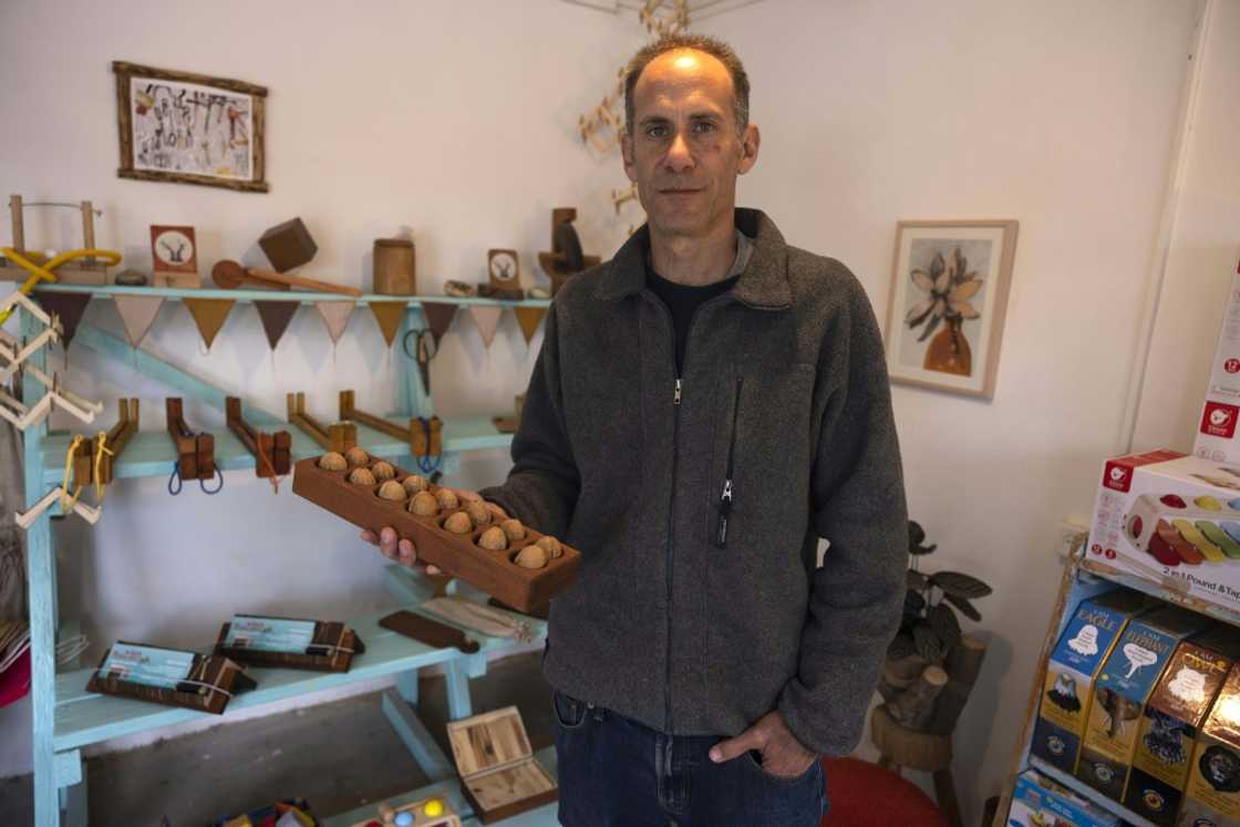 Standing in a former factory in Hanita, a kibbutz in Israel's north, Yuval Vakrat is surrounded by shops, an art gallery and a distillery Standing in a former factory in Hanita, a kibbutz in Israel's north, Yuval Vakrat is surrounded by shops, an art gallery and a distillery