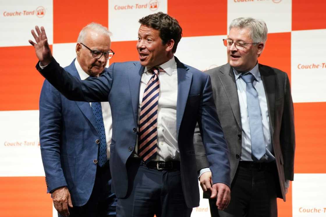 'We are going to invest in Japan,' said Alimentation Couche-Tard President Alex Miller (C) 'We are going to invest in Japan,' said Alimentation Couche-Tard President Alex Miller (C)
