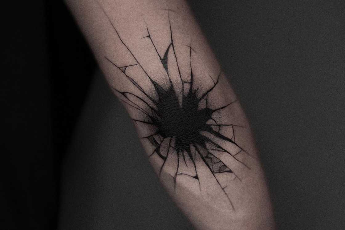 Black broken glasses elbow tatto Black broken glasses elbow tatto