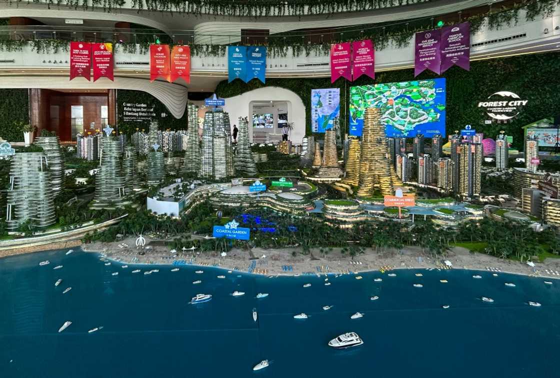 Model sculptures of Forest City's completed four artificial islands -- far from its current state -- sit in a sales showroom Model sculptures of Forest City's completed four artificial islands -- far from its current state -- sit in a sales showroom