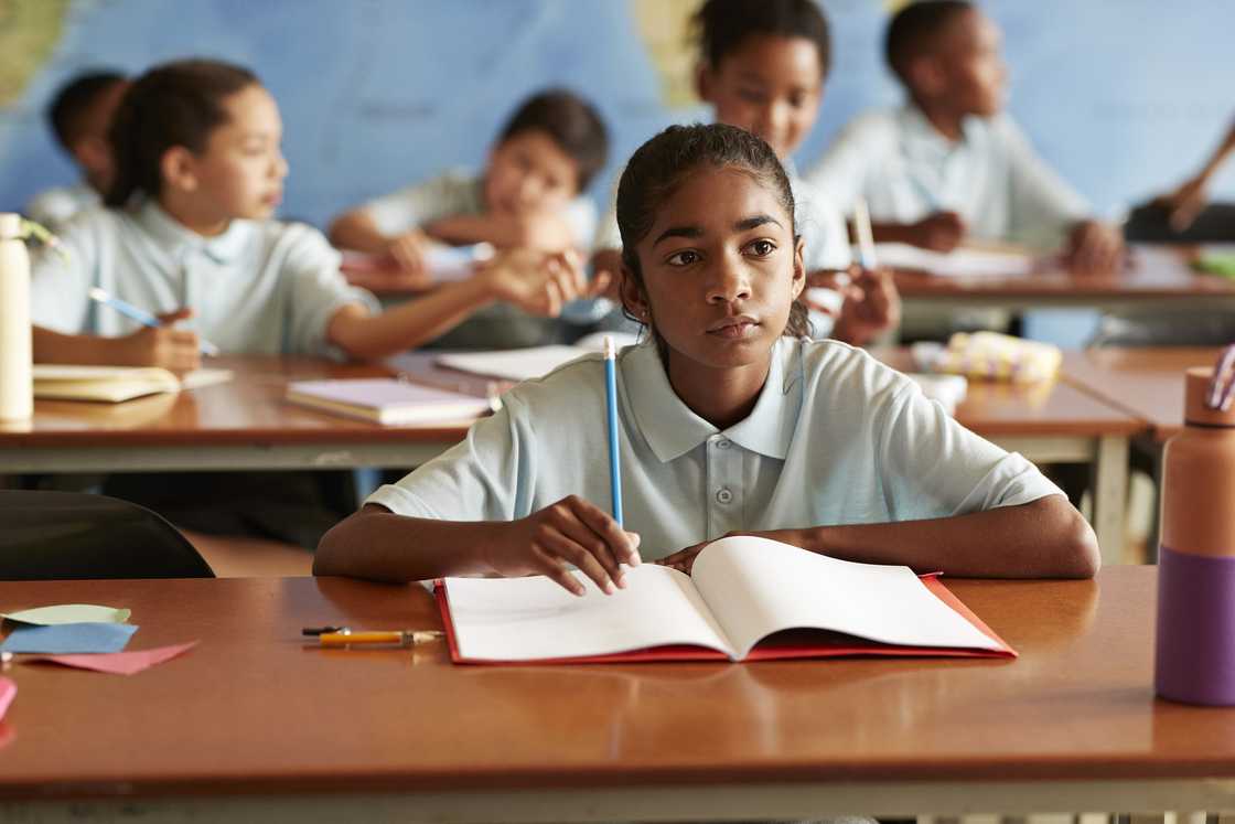 School classroom with children writing. School classroom with children writing.