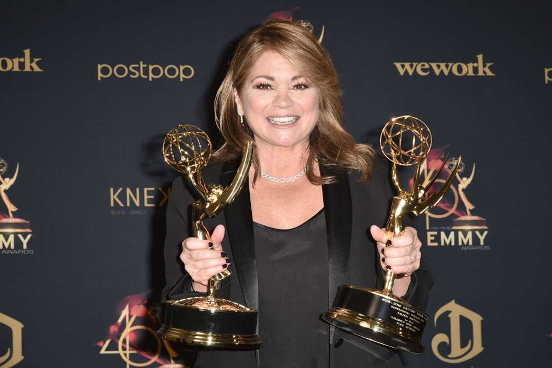 Valerie Bertinelli holding two awards Valerie Bertinelli holding two awards