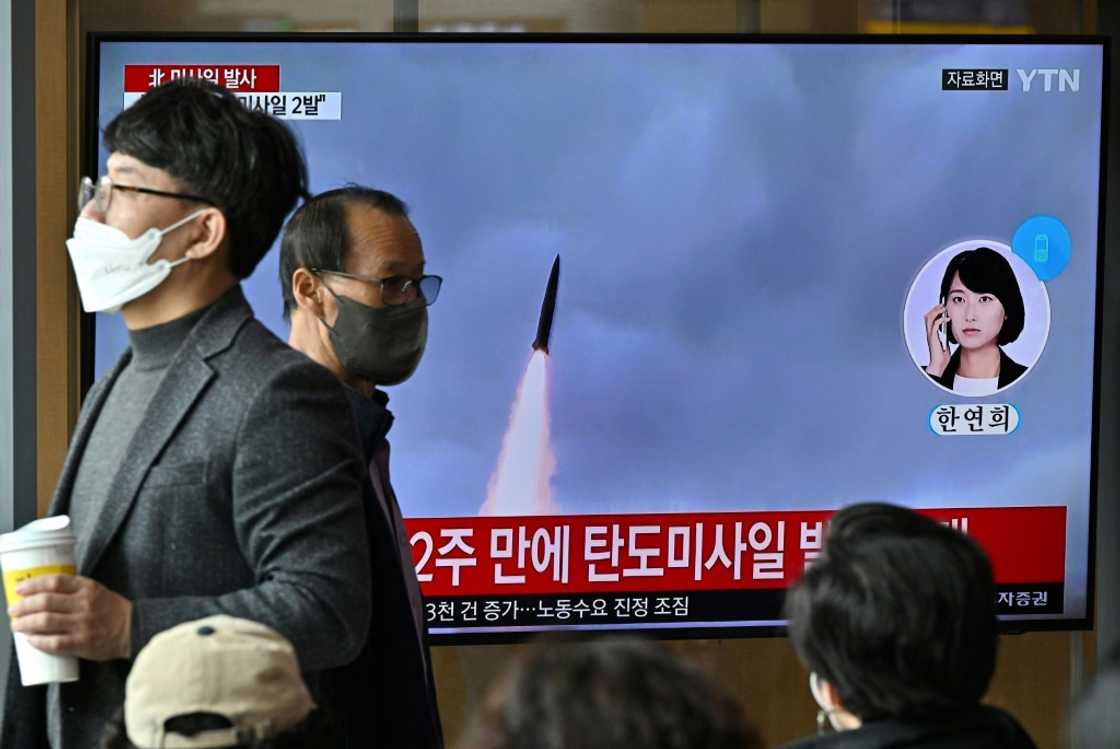 People watch a television screen showing a news broadcast with file footage of a North Korean missile test at a railway station in Seoul on October 28 People watch a television screen showing a news broadcast with file footage of a North Korean missile test at a railway station in Seoul on October 28