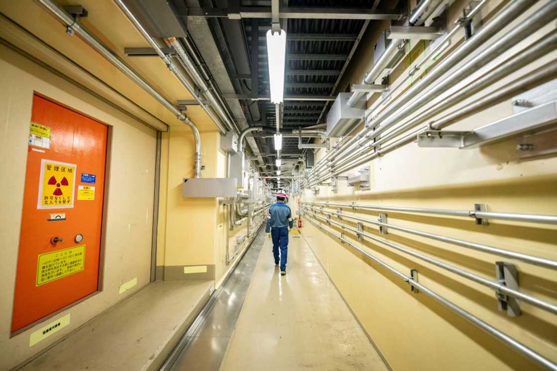 Masaki Daito, deputy superintendent of the Kashiwazaki-Kariwa nuclear power station, walks through a corridor inside the unit 7 reactor building Masaki Daito, deputy superintendent of the Kashiwazaki-Kariwa nuclear power station, walks through a corridor inside the unit 7 reactor building