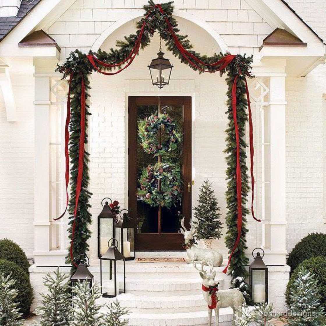 A house is decorated with convectional evergreen garland