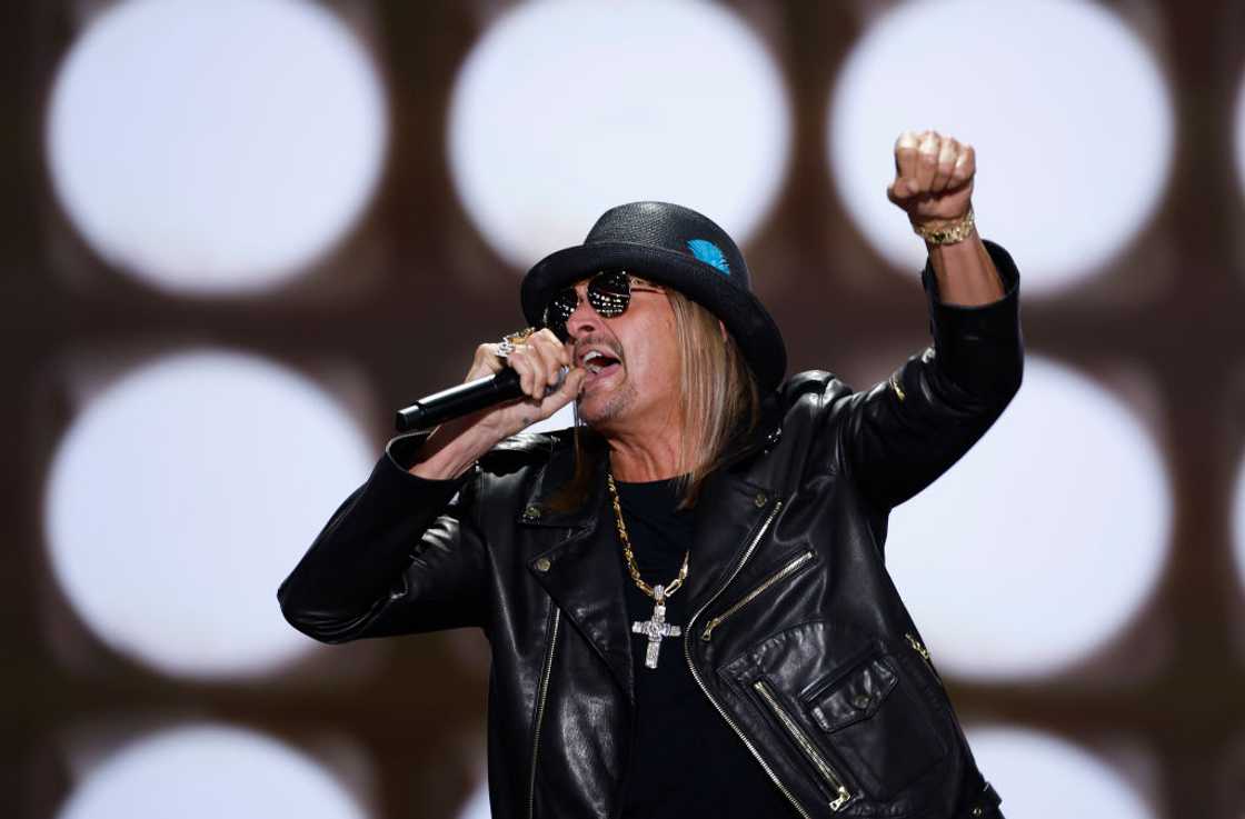 Kid Rock in an all black attire during a performance Kid Rock in an all black attire during a performance