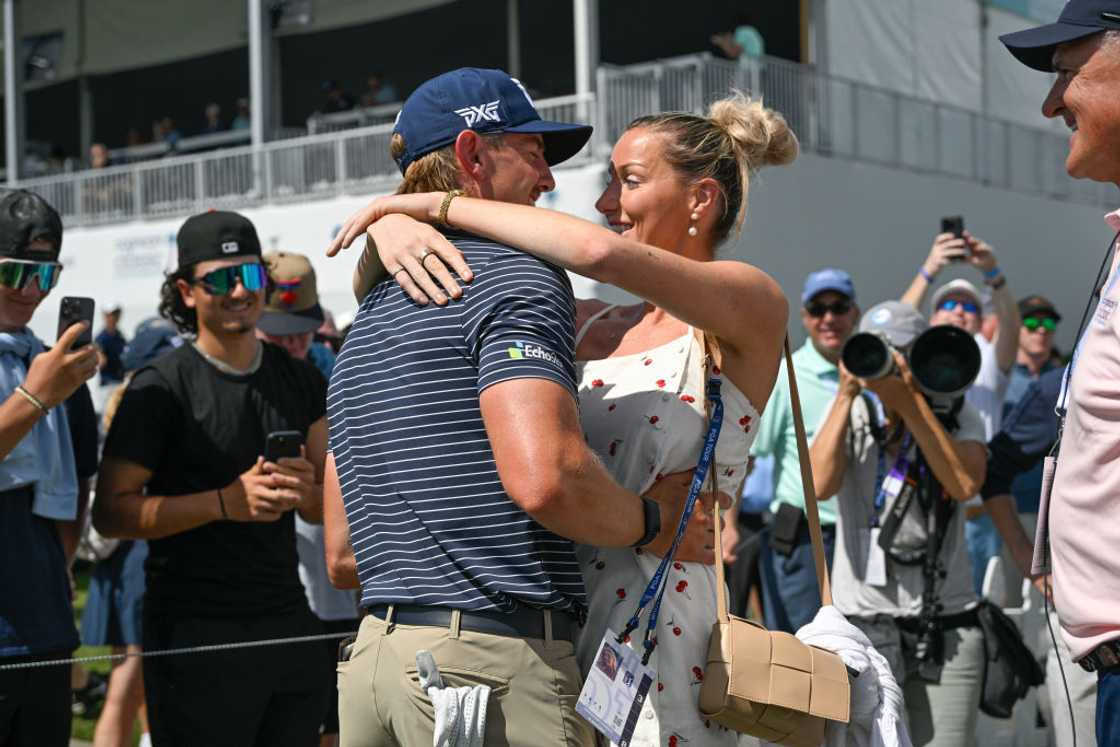 ake Knapp hugs his girlfriend, Makena White.