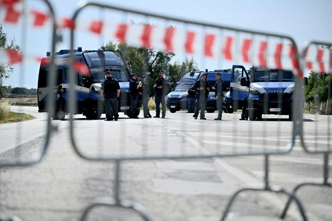 Security at the summit is tight, with the venue far away from protesters and journalists