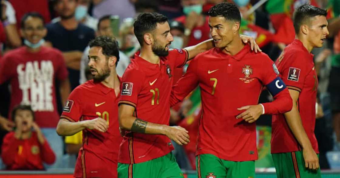 Bruno Fernandes of Portugal celebrates with teammate Cristiano Ronaldo after scoring a goal during the 2022 FIFA World Cup Qualifier match between Portugal and Luxembourg at Estadio Algarve on October 12, 2021 in Loule, Portugal. (Photo by Gualter Fatia) Bruno Fernandes of Portugal celebrates with teammate Cristiano Ronaldo after scoring a goal during the 2022 FIFA World Cup Qualifier match between Portugal and Luxembourg at Estadio Algarve on October 12, 2021 in Loule, Portugal. (Photo by Gualter Fatia)