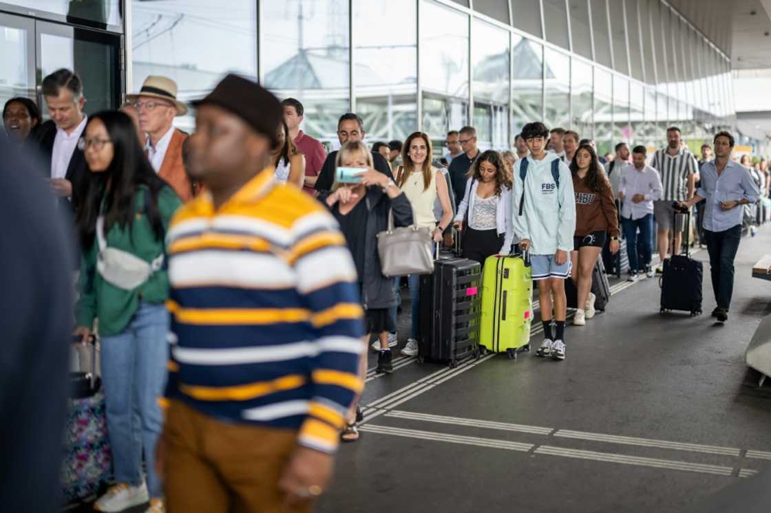 Travellers queued to enter Geneva International Airport before the strike was extended to last through Saturday