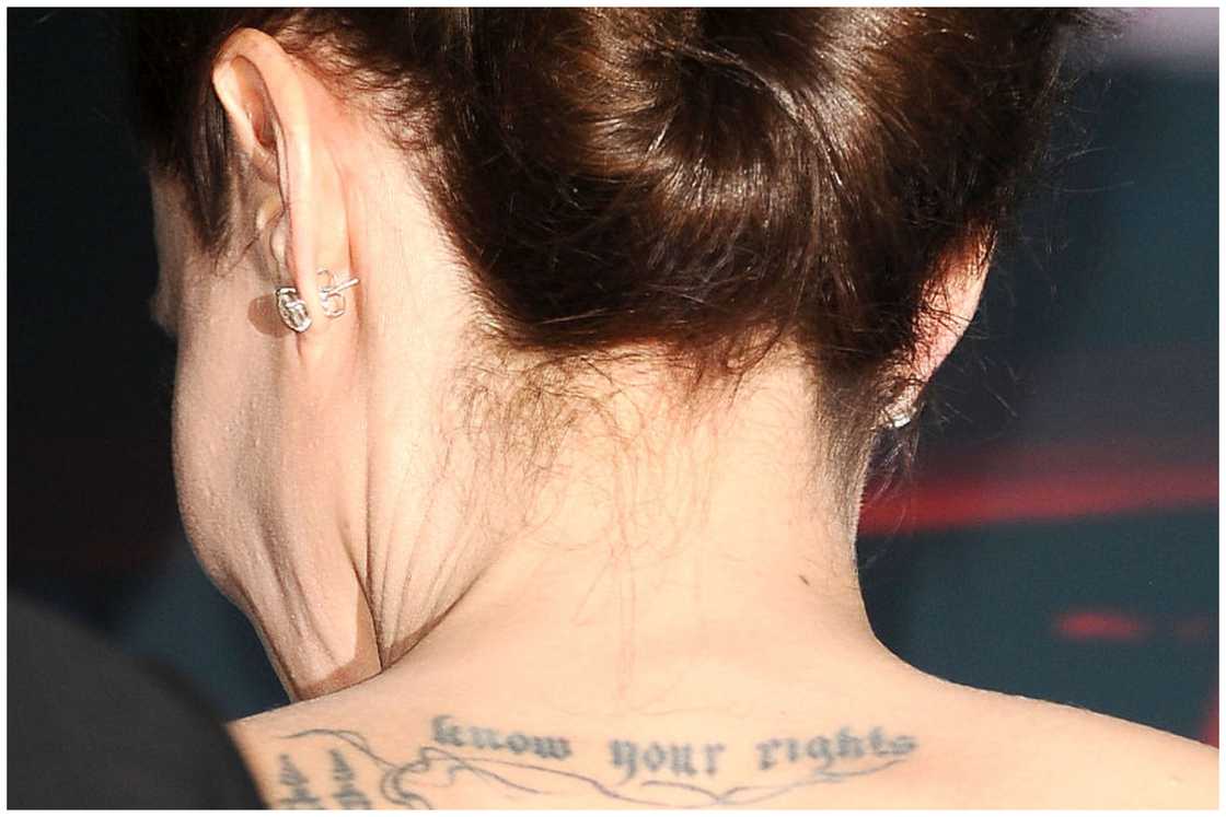 Actress Angelina Jolie's know your rights tattoo as she poses in the press room at the 18th annual Hollywood Film Awards at Hollywood Palladium in Hollywood, California. Actress Angelina Jolie's know your rights tattoo as she poses in the press room at the 18th annual Hollywood Film Awards at Hollywood Palladium in Hollywood, California.