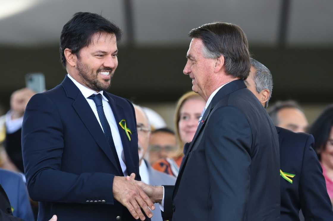Brazilian President Jair Bolsonaro (R) is seen with his communications minister Fabio Faria in Brasilia on August 25, 2022 Brazilian President Jair Bolsonaro (R) is seen with his communications minister Fabio Faria in Brasilia on August 25, 2022